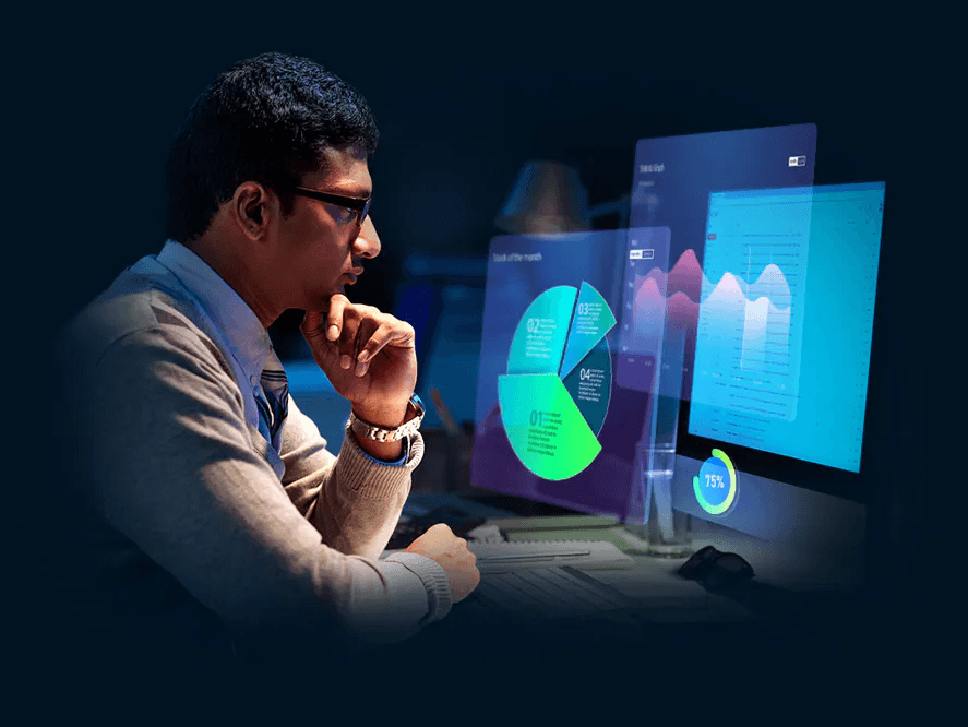 Hombre pensativo viendo graficas de datos en la pantalla de su computadora